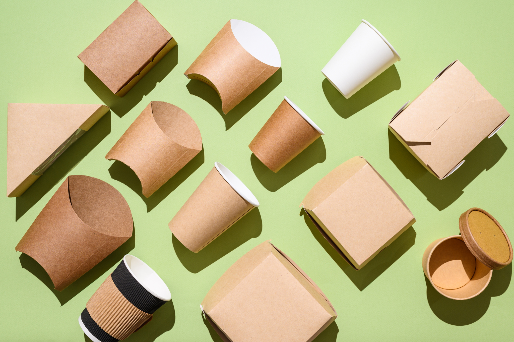 Cardboard Packaging on Green Background