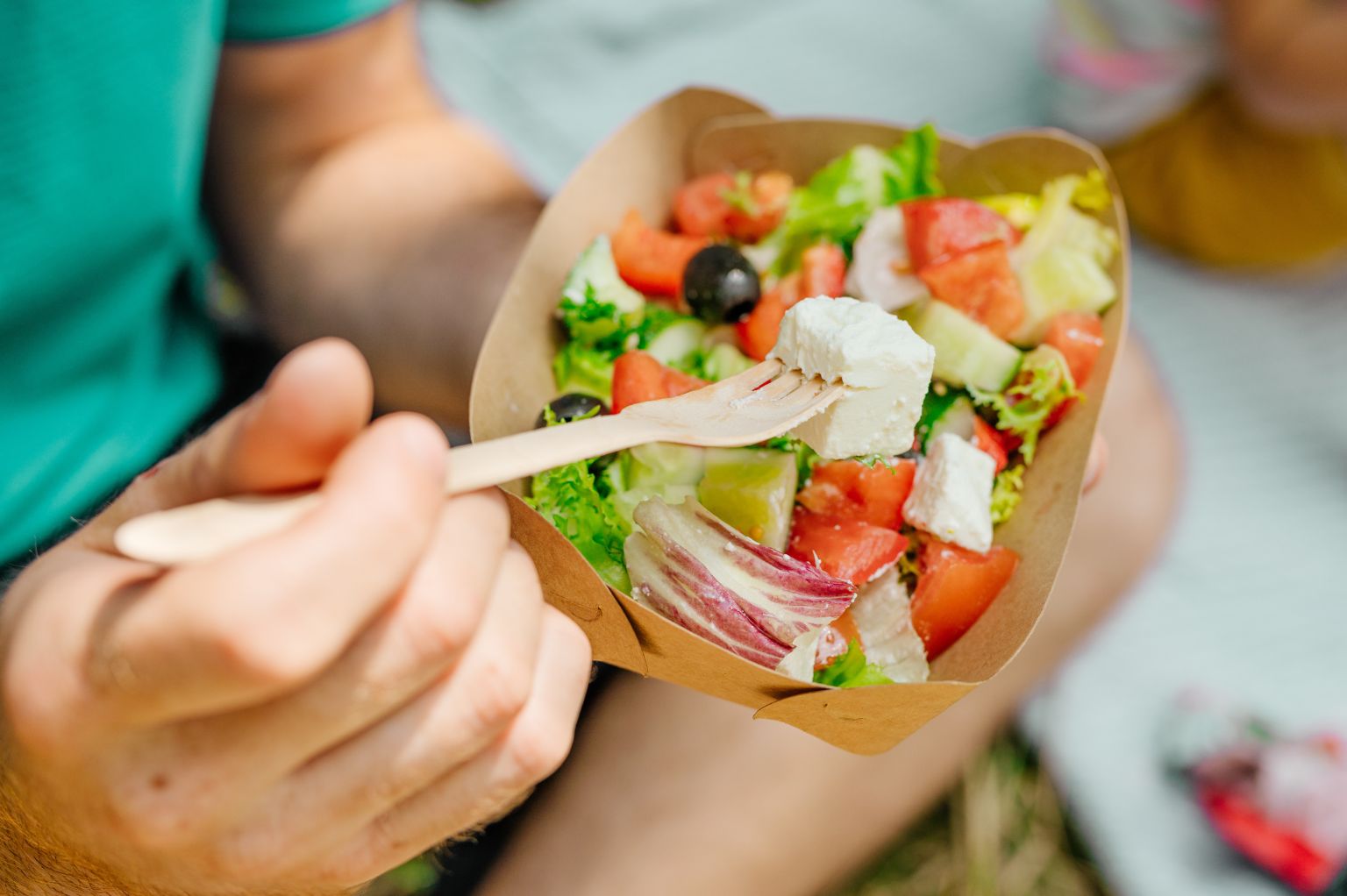 Food Being Eaten out of Recyclable Food Container