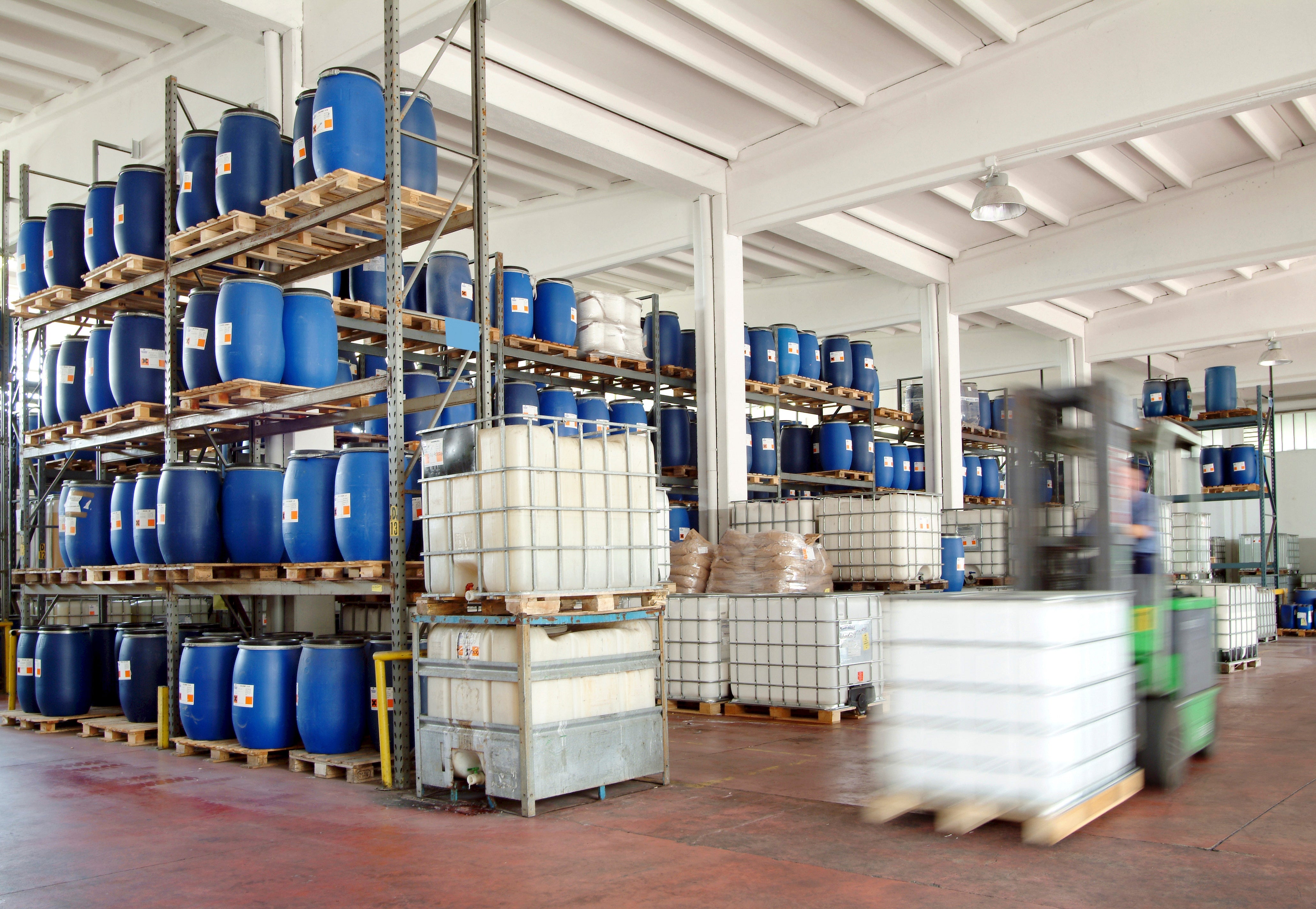 Manufacturing warehouse with totes and forklift