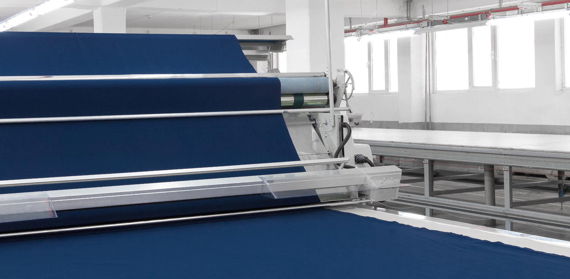 Textile barrier coatings with UV protection and flame retardant which are fluorine-free